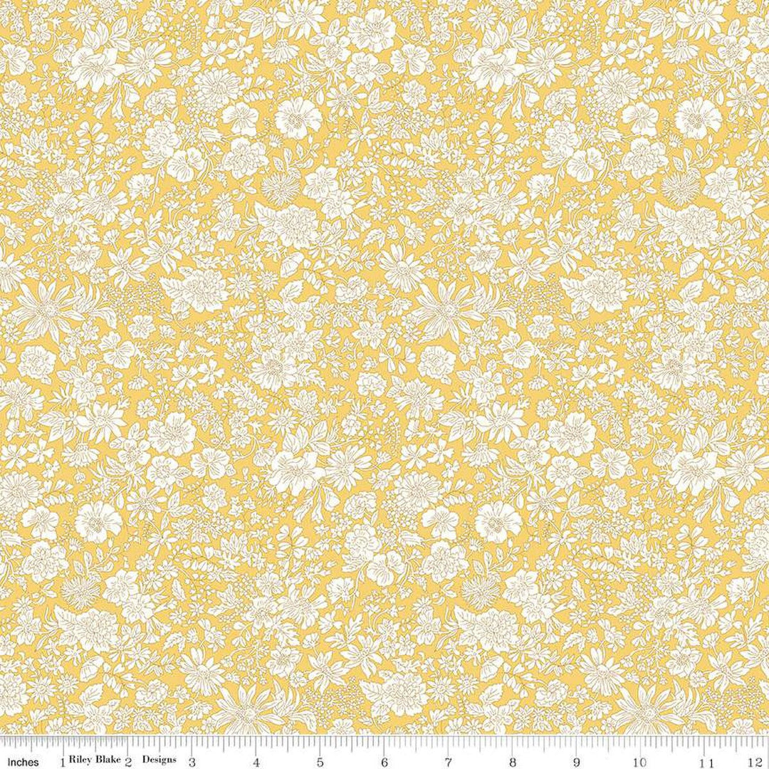 A closeup shot of the quilting fabric pattern called Sunshine Yellow, part of Liberty Fabric's Emily Belle fabric collection by Riley Blake. SKU is 01666401A.