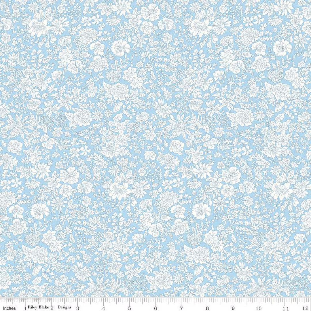 A closeup shot of the quilting fabric pattern called Sky Blue, part of Liberty Fabric's Emily Belle fabric collection by Riley Blake. SKU is 01666408A.