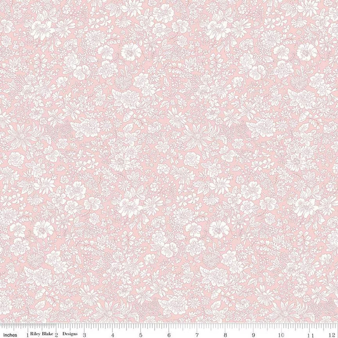 A closeup shot of the quilting fabric pattern called Powder Rose, part of Liberty Fabric's Emily Belle fabric collection by Riley Blake. SKU is 01666422A.