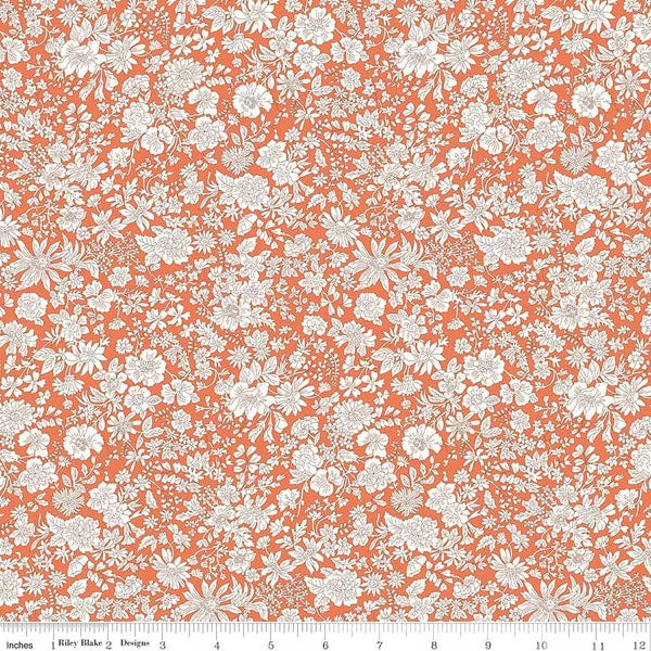 A closeup shot of the quilting fabric pattern called Tangerine, part of Liberty Fabric's Emily Belle fabric collection by Riley Blake. SKU is 01666432A.