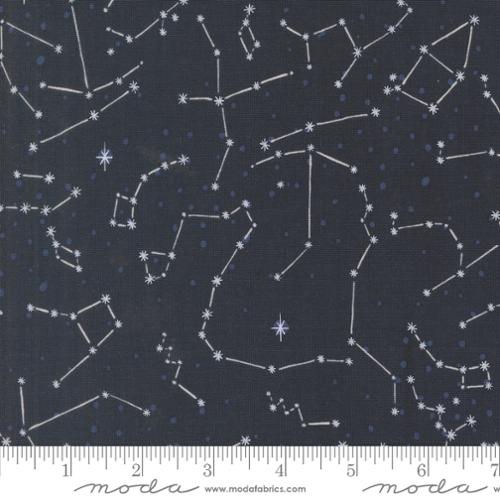 A closeup shot of the quilting fabric pattern called The Constellation, designed by Stacy Iest Hsu, in the night sky colorway. The SKU is 20954 15.