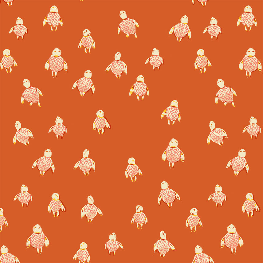 A closeup shot of the quilting fabric pattern called Sea Turtles, designed by Heather Ross, in the orange colorway. The SKU is 52150-15.