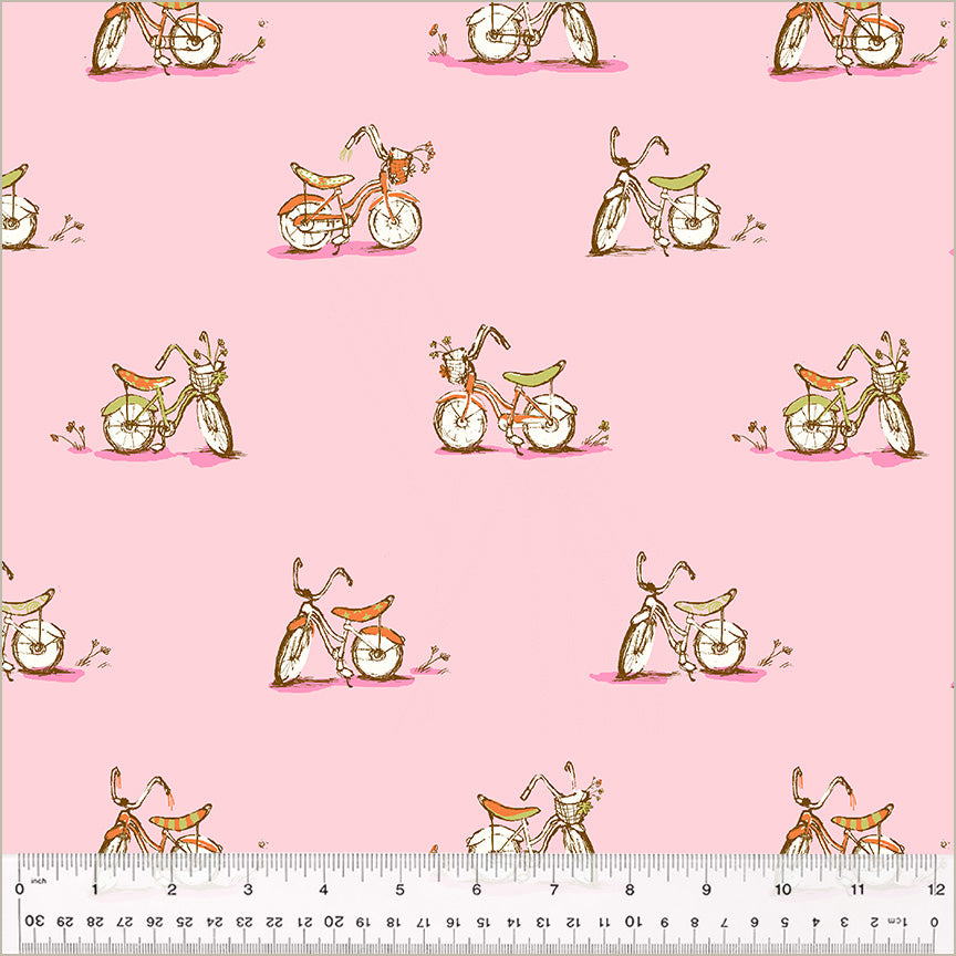 A closeup shot of the quilting fabric called Dream Bike, by Heather Ross, in the pink colorway. The SKU is 54327D-6.