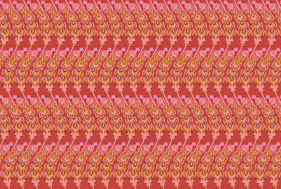 A closeup shot of the quilting fabric pattern called Bells of Ireland, designed by Anna Maria Horner, in the coral colorway. The SKU is AMT133-38V.