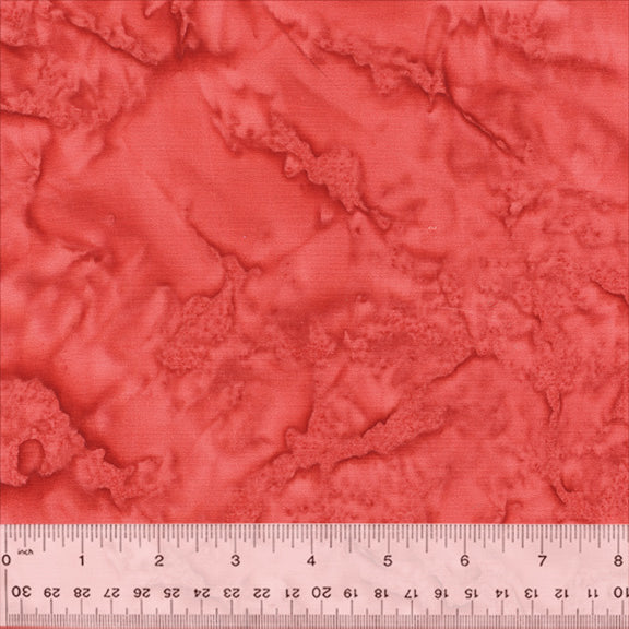 A closeup shot of the quilting fabric pattern called BeColourful Blush, designed by Jacqueline de Jonge, in the poppy colorway. The SKU is BCB8Q-X.