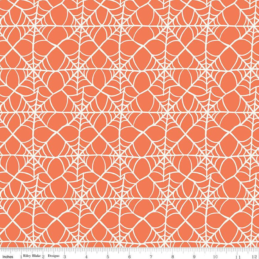 A closeup shot of the quilting fabric pattern called Webs, designed by My Mind's Eye for Riley Blake, in the orange colorway. The SKU is C16033-ORANGE.