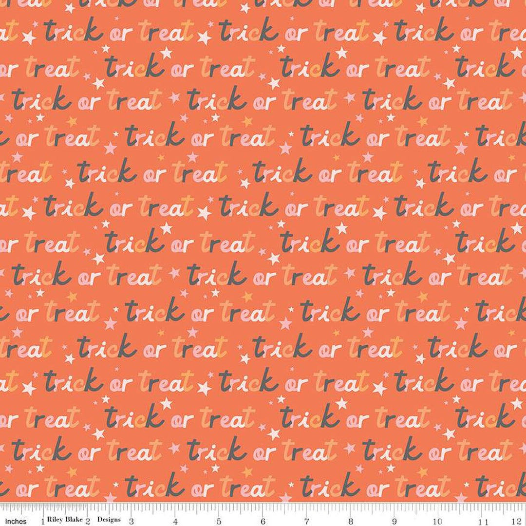 A closeup shot of the quilting fabric pattern called Trick or Treat, designed by My Mind's Eye for Riley Blake, in the orange colorway. The SKU is C16034-ORANGE.