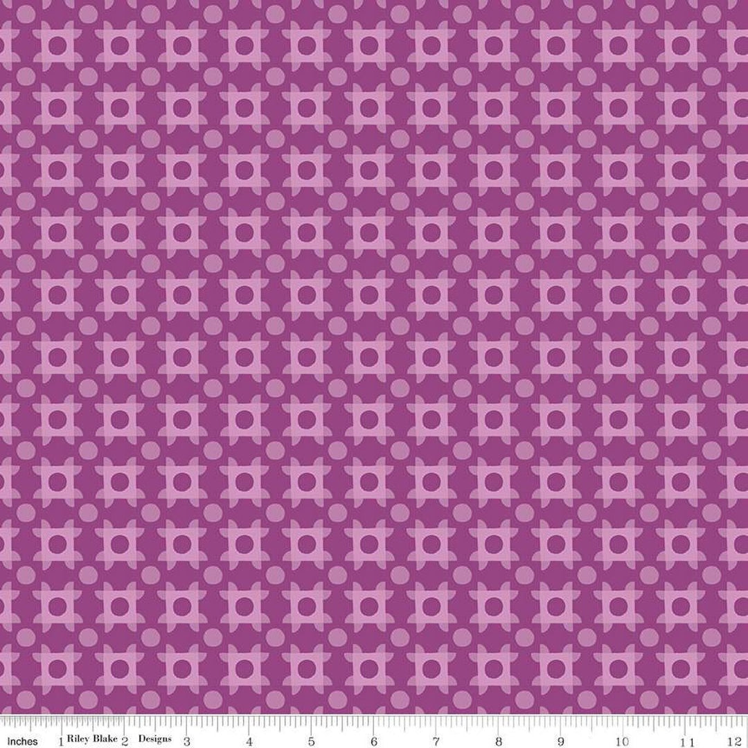 A closeup shot of the quilting fabric pattern called Patchwork Piazza, designed by Genesis Hall, in the grape colorway. The SKU is C16933-GRAPE.