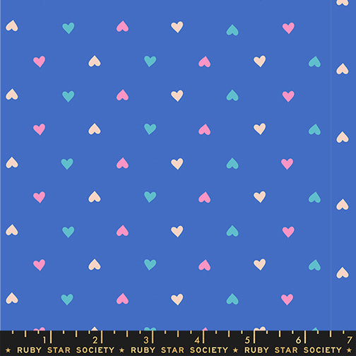 A closeup shot of the quilting fabric pattern called Hearts, designed by Melody Miller for Ruby Star Society, in the lapis colorway. The SKU is RS0091 16.