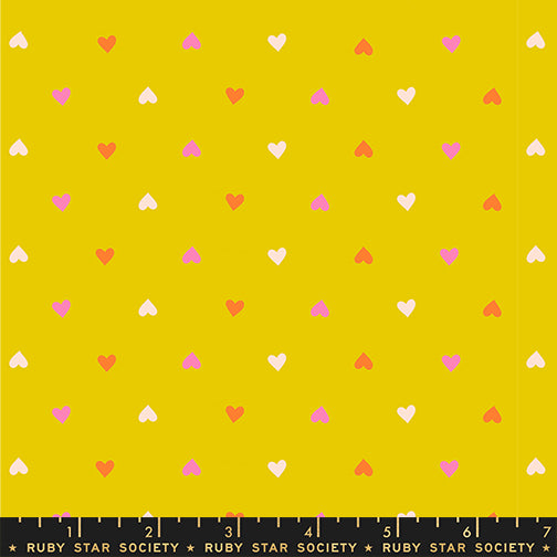 A closeup shot of the quilting fabric pattern called Hearts, designed by Melody Miller for Ruby Star Society, in the golden hour colorway. The SKU is RS0091 17.