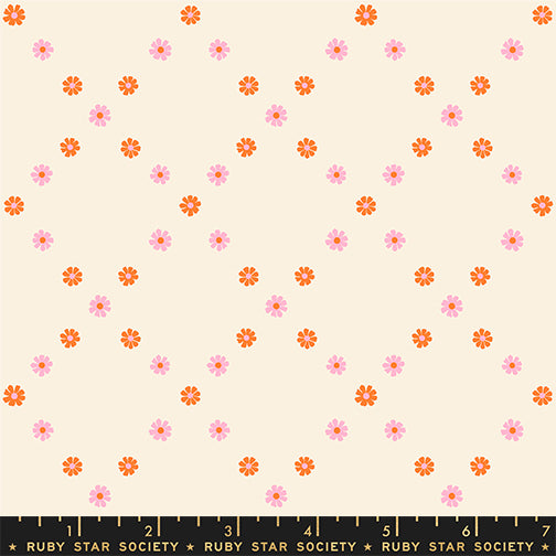 A closeup shot of the quilting fabric pattern called Diamond Flowers, designed by Melody Miller for Ruby Star Society, in the posy orange colorway. The SKU is RS0107 12.