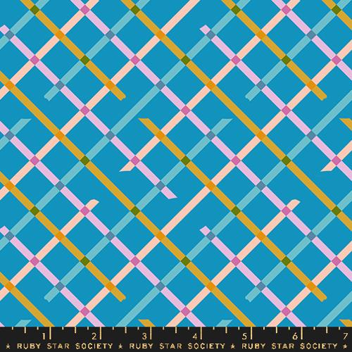 A closeup shot of the quilting fabric pattern called Off Grid, designed by Rashida Coleman Hale, in the bright blue colorway. The SKU is RS1104 15.