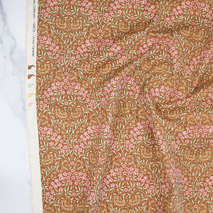 Cotton quilting fabric pattern called 'Larissa Caramel'. Part of the 'Sanctuary' fabric collection. Designed by Tone Finnanger for fabric company Tilda Fabrics. SKU: TIL100570. 44-45 inch width.