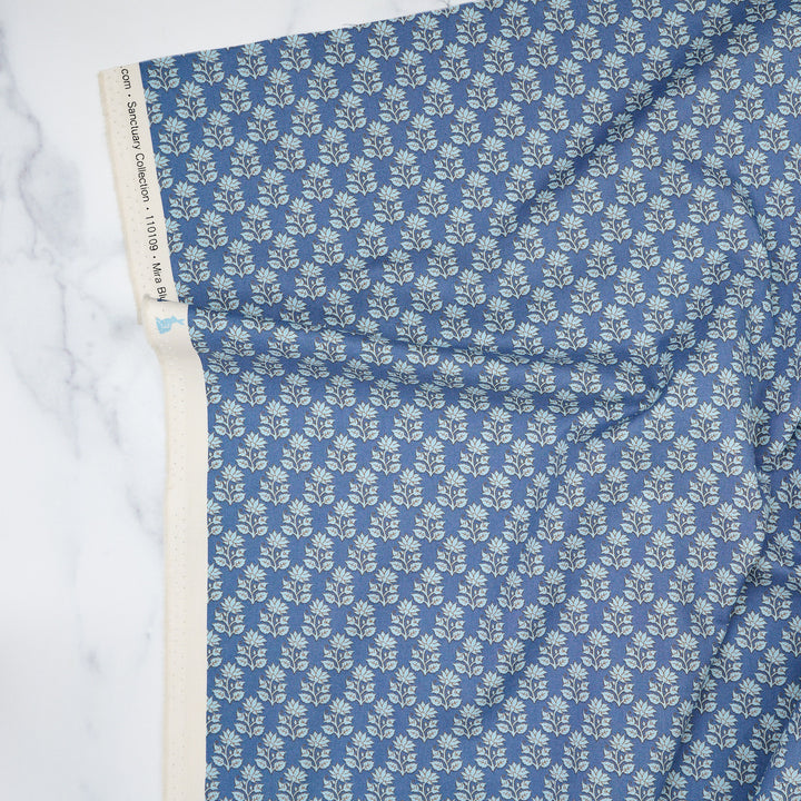 Cotton quilting fabric pattern called 'Mira Blue'. Part of the 'Sanctuary' fabric collection. Designed by Tone Finnanger for fabric company Tilda Fabrics. SKU: TIL110109. 44-45 inch width.